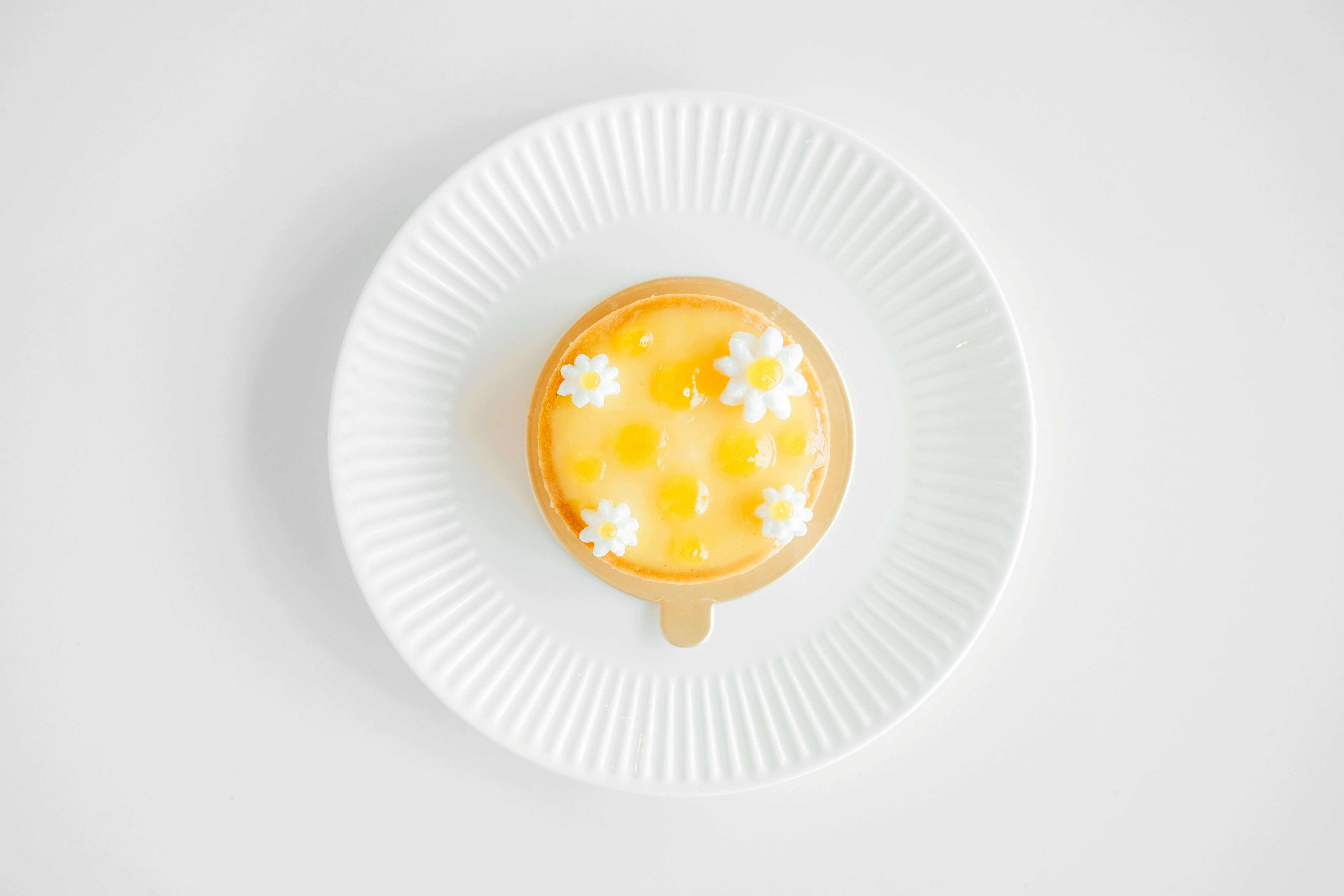 flat-lay photography of custard cake on white plate